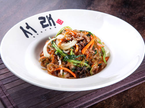 Seorae Korean Charcoal BBQ’s Japchae features rice noodle stir-fried with pork or beef and fresh vegetables, delivered islandwide in Singapore powered by Oddle