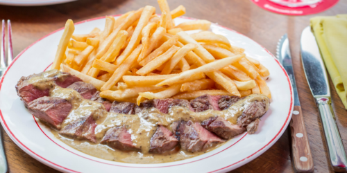 A signature Trimmed Entrecote Steak drizzled with special sauce and paired with a side of golden-brown fries delivered islandwide in Singapore powered by Oddle