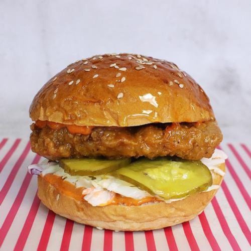A chicken burger with pickles, slaw and glazed brioche buns. The Sweet Seoulmate Burger from Phat Fingers, with islandwide food delivery in Singapore powered by Oddle.
