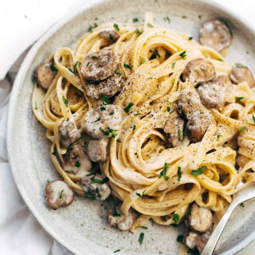 A plate of carbonara with mushrooms. Creamy Mushroom Carbonara from Saveur, delivered islandwide in Singapore powered by Oddle.