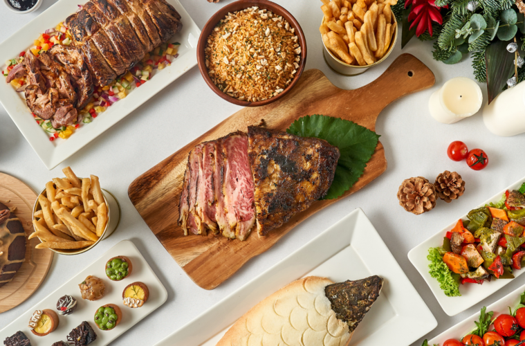 A flatlay of dishes on a tably, such as Salted Barramundi, Dessert Canape, and more. From Thank Goodness It's Christmas, delivered islandwide in Singapore powered by Oddle.