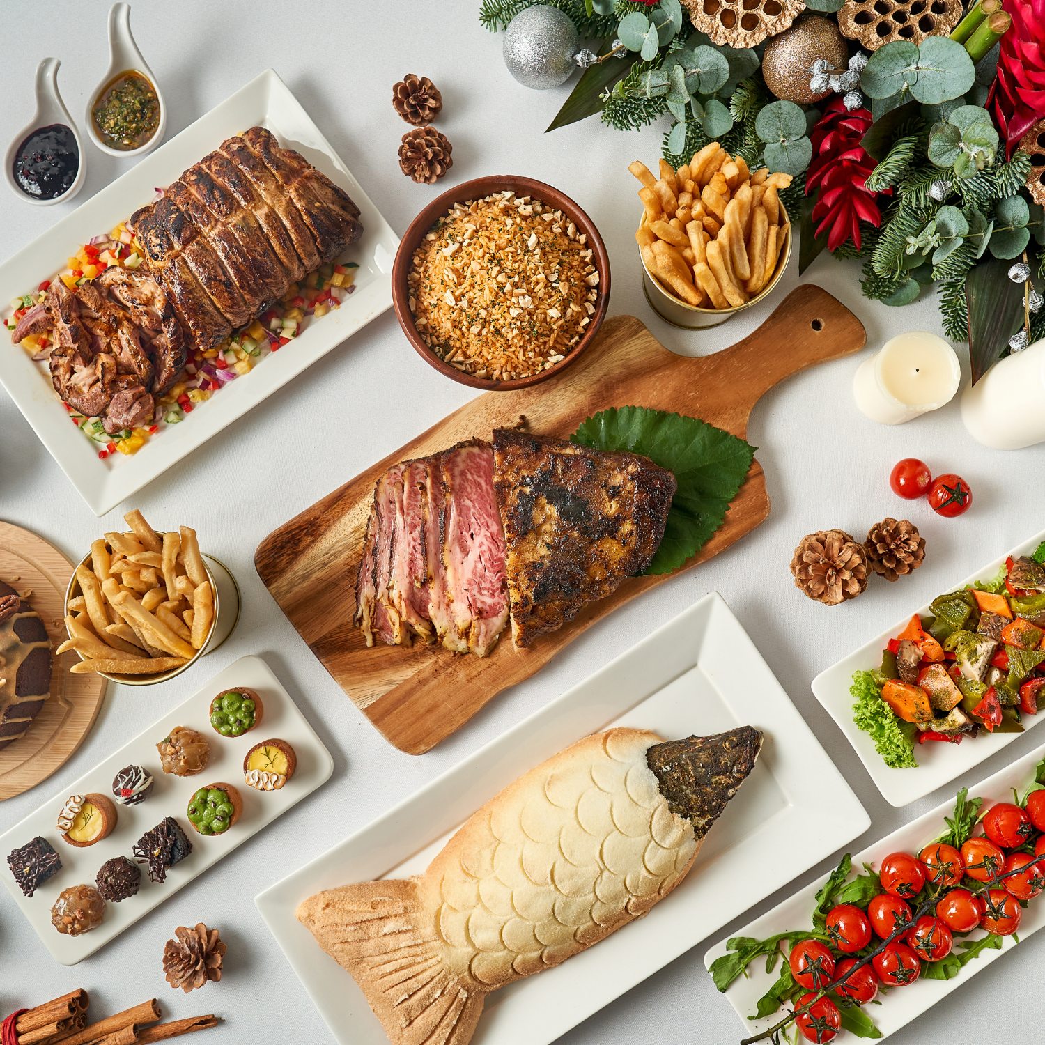 A flatlay of dishes on a tably, such as Salted Barramundi, Dessert Canape, and more. From Thank Goodness It's Christmas, delivered islandwide in Singapore powered by Oddle.