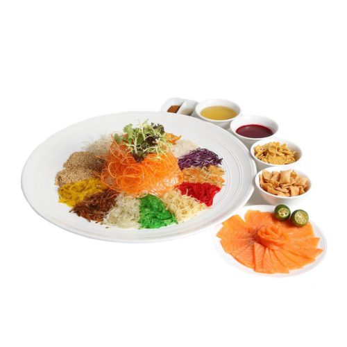 A platter of yu-sheng with accompanying sauces, crackers and smoked salmon. Prosperity Yu-sheng Platter with Smoked Salmon, delivered islandwide in Singapore powered by Oddle.