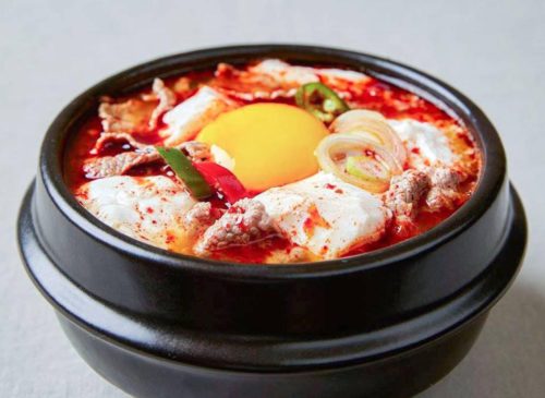 A bowl of soondubu stew. Original Beef Soontofu from SBCD Korean Tofu House, delivered islandwide in Singapore powered by Oddle.