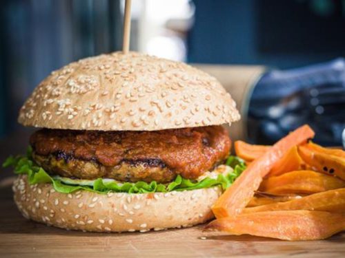 Hormone-free chicken patty in the Rebel Chicken Burger with a thick sauce, served with sweet potato fries. Healthier food, delivered islandwide in Singapore, powered by Oddle